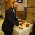 Rabbi cutting the Challah